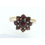 A 9 carat gold garnet cluster ring, size R/S