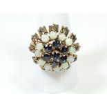 A 14 ct gold vintage dome top ring set sapphires and opals, size Q1/2