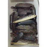 A collection of folding multi-tool knives - approximately twenty in total