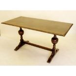 A small oak refectory table on cup and cover supports 153cm width