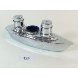 A chrome cruet set in the form of a cruise liner