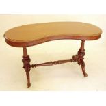 A Victorian mahogany kidney shaped stretcher table - leg loose