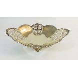 A silver gilt panelled and pierced oval dish, 470g, 29cm wide, London 1932, by Josiah Williams & Co