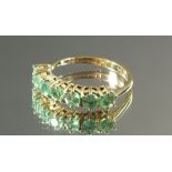 A 9ct gold emerald ring - size L.