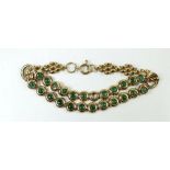 A gold bracelet set with 23 emeralds (1 deficient), 14g