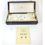 A bone and bamboo Mah Jong set by 'Bee Brand', boxed with instructions
