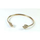 A 9 carat gold Celtic style torque bangle, maker S & D - 6.9 grams