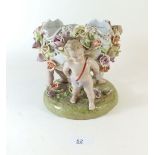 A Dresden German porcelain bowl decorated with cherubs and flowers 18cm tall
