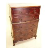 A reproduction mahogany chest of five drawers