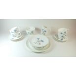 A Wedgwood 'Ice Rose' part tea service comprising: cup and saucer, milk, sugar, five tea plates