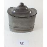 A 19th century pewter tobacco box with domed lid and inner liner