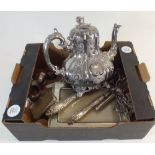 A box of silver plated items including candle snuffers and Rococo style teapot etc