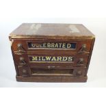 An old stained wood advertising Milwards haberdashery box with mirrored drawer fronts a/f, 36 x 21 x