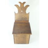 A Georgian oak salt box with shaped back plate- 41cm tall