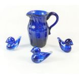 An early 19th century Bristol Blue glass ribbed jug 8cm and three blue glass miniature ducks