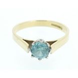 An 18ct gold ring set with blue topaz - size N.