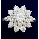 An 18ct white gold cluster ring set paste, size M/N
