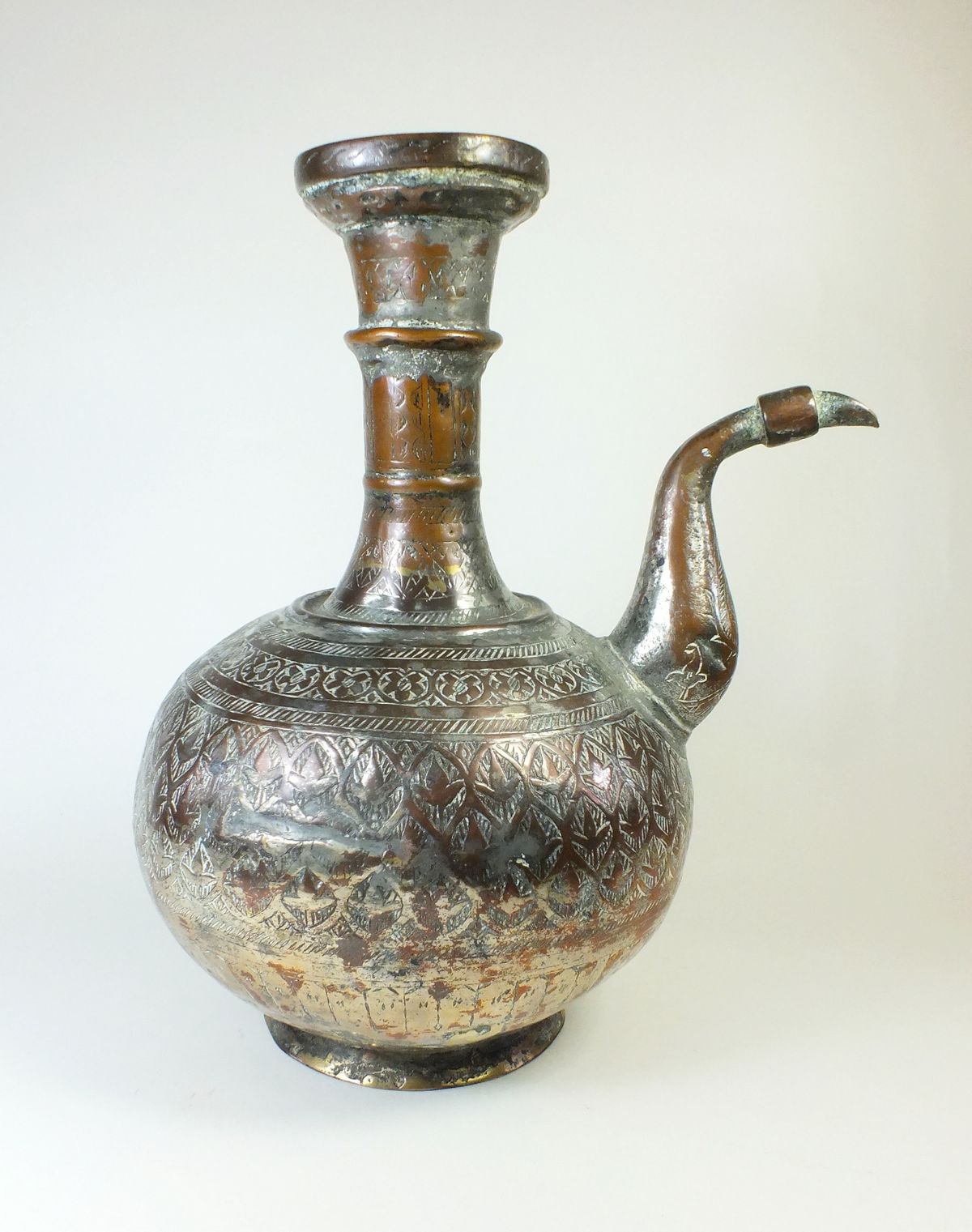 A 19th century Persian or Afghan Islamic tinned copper aftaba/water pot, 29cm tall