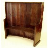 An early 18th century elm small sized tavern curved back settle, 140 w x 142cm h
