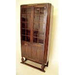 An oak 1930's two door glazed display cabinet