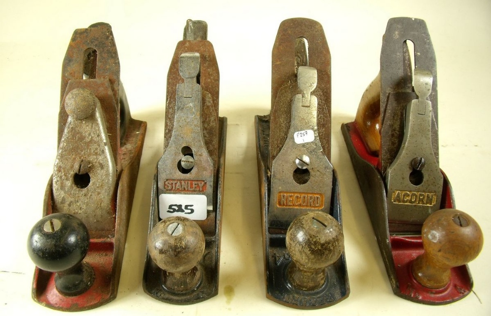 A set of four vintage planes to include a Record No 4, a Stanley Chapman Tools No 4, a Rapier 400