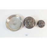 Two circular silver dressing table boxes embossed flowers and a small 800 standard silver dish, 110g