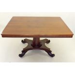 A Victorian mahogany tilt top rectangular breakfast table on tapered column and quadruple scroll