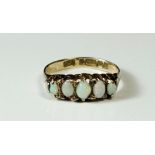 A 9 carat gold ring set five graduated opals, size P