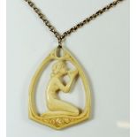 A 1920's Art Deco carved ivory pendant with kneeling nude drinking from a cup 5.5 cm x 4 cm, on 9 ct