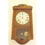 An early 20th century oak wall clock - 55cm tall