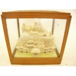 A finely carved balsa wood model of Tiruchirapalli Rock Fort in Tamil Nadu, India cased, 27 x 23 x