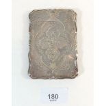 A silver card case with engraved floral swag and rose decoration, 61g, Birmingham 1857, by G Wheeler