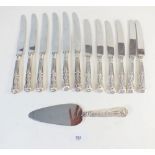 A set of six silver handled kings pattern dinner knives and six dessert knives plus a cake slice,