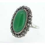 A silver and marcasite ring set green stone, Size L