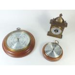 A Comitti circular barometer and two other barometers
