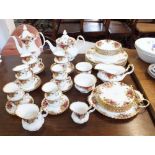 A Royal Albert Country Roses tea and dinner service comprising:- six dinner plates, eight side