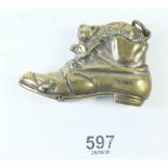 A late 19th century/early 20th century brass vesta case in the form of a cat in a boot
