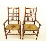 A pair of 19th century rush seated spindle back carver chairs
