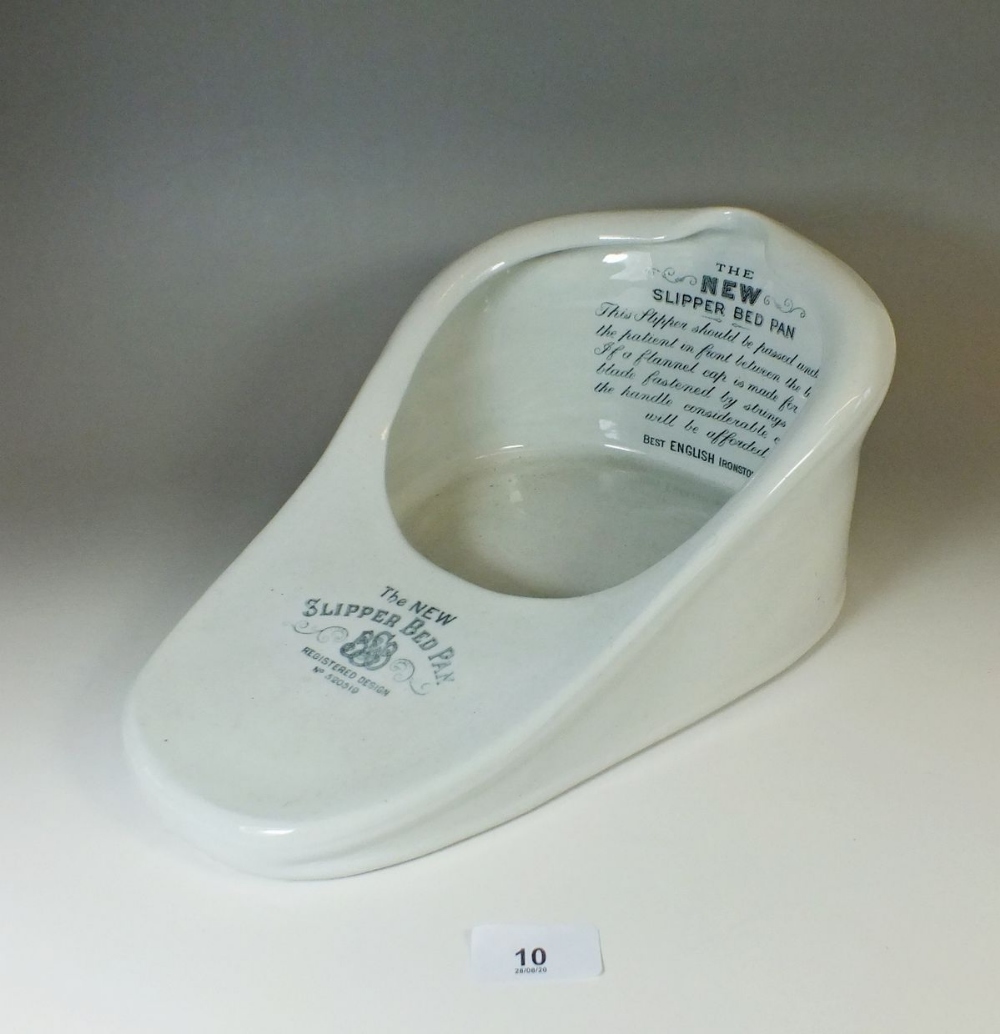 A 'New Slipper' china bed pan