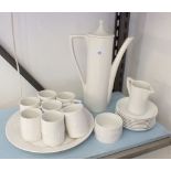 A white Portmeirion matched coffee set comprising: seven Totem cups and eights saucers, cake plate