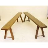 A pair of long benches of jointed construction (one 19th century and the other presumably made at