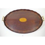 An Edwardian mahogany inlaid oval two handled tray