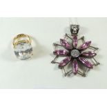 A Juicy Couture dress ring, size L/M and a large flower form silver pendant