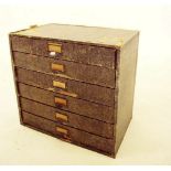 A vintage Winel table top stationery cabinet of 6 drawers 38cm tall