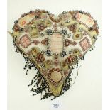 A Victorian beaded glass heart form sweetheart cushion - 20cm