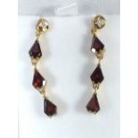 A pair of 9 carat gold garnet pendant earrings