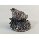 A filled silver model of a quail, marked Langton and CA, 5.5cm tall