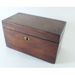 A mahogany tea caddy with two interior lidded compartments, 20cm wide