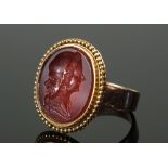 A Georgian gold gentleman's seal ring carved cornelian double faced illusion cameo - unmarked, 7.4g,