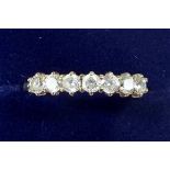 A 9 carat gold ring set seven white stones - size N 1/2